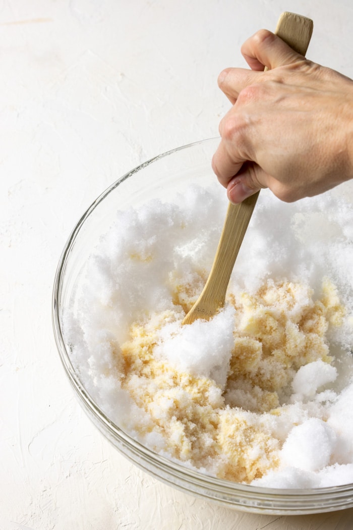 stirring the snow ice cream ingredients together - showing how it clumps together