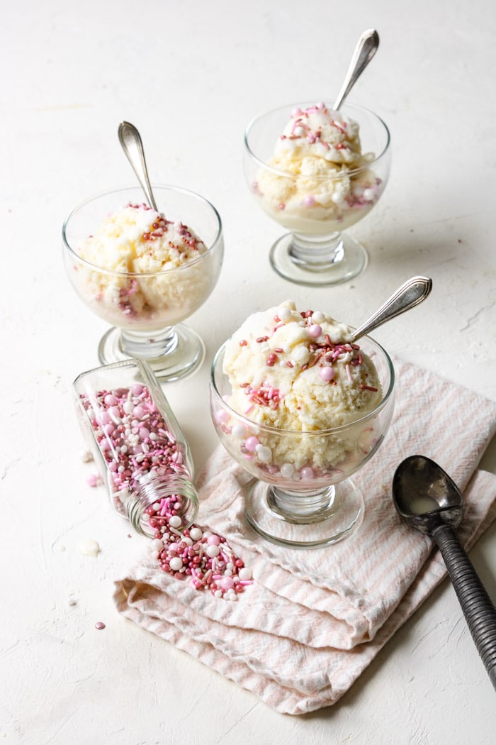 three bowls of snow ice cream with pink sprinkles
