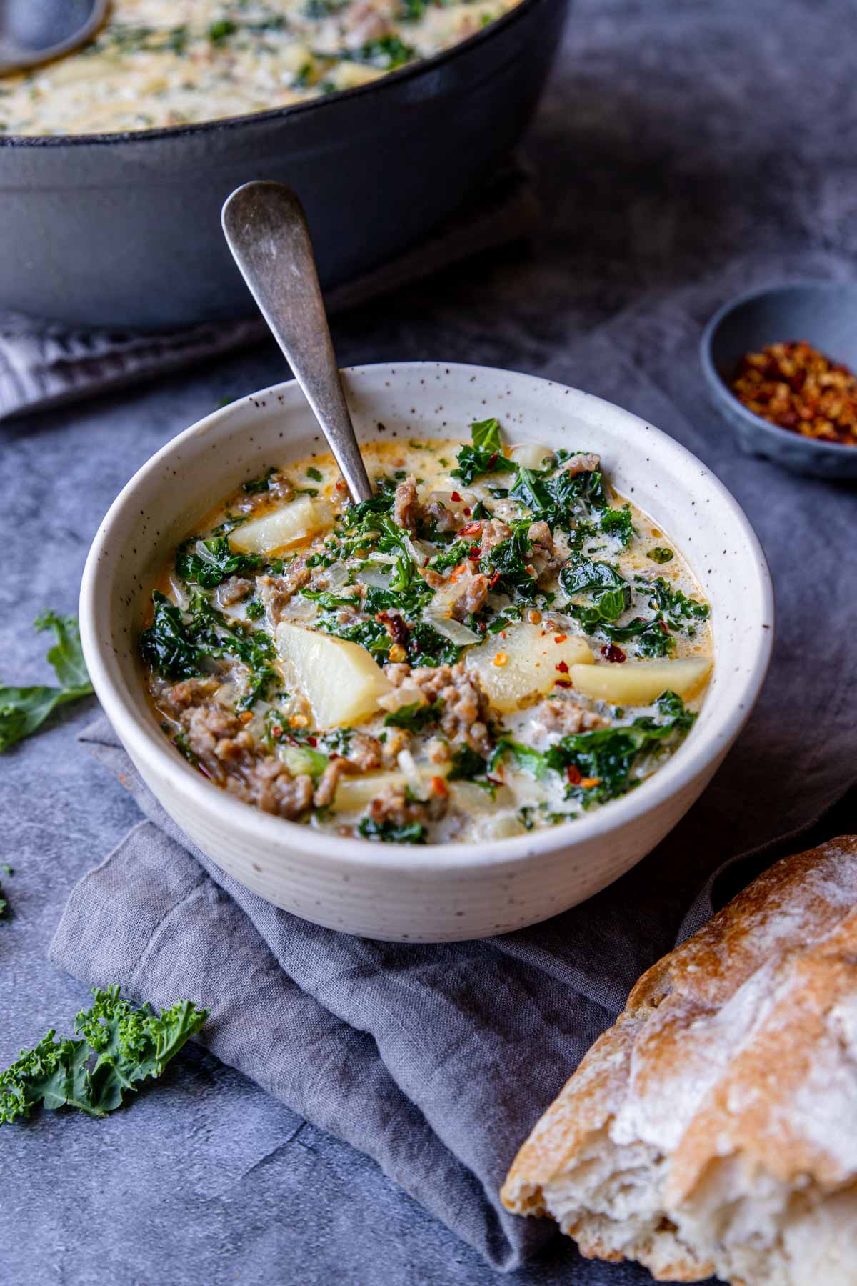 Instant Pot Zuppa Toscana in a bowl with a spoon