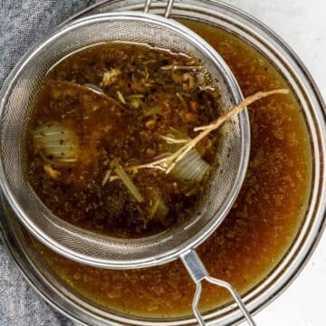 liquid from the bottom of the Instant Pot being strained