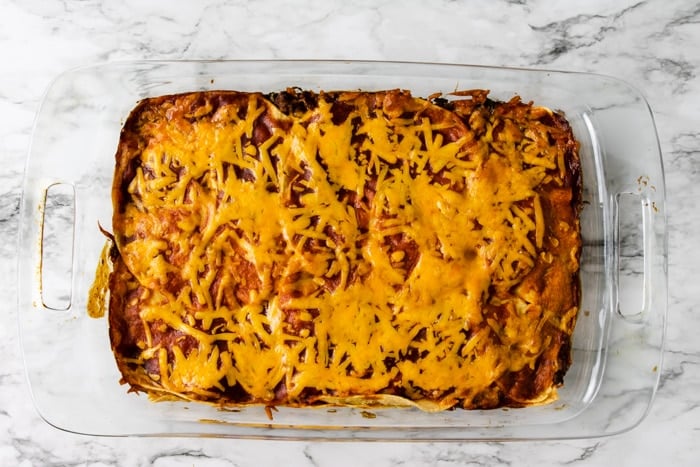 Baked Enchilada casserole in a glass dish
