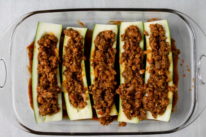 zucchini boats filled with Italian sausage