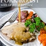 Instant Pot Pork Roast sliced on a plate with veggies and gravy being poured over top - pinterest text overlay