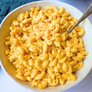 a large bowl of mac and cheese with a spoon