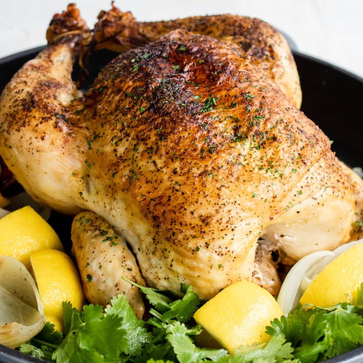 Rotisserie Chicken on a bed of parsley and lemons
