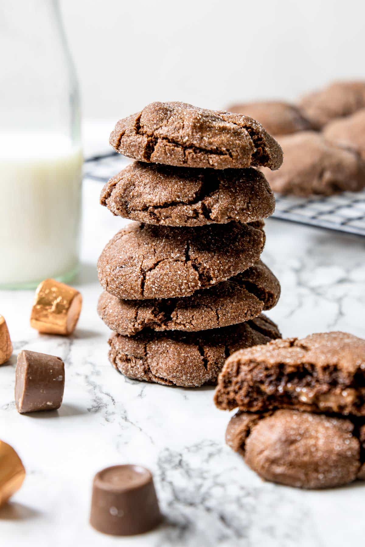 stack of chocolate cookies with rolos around on the table