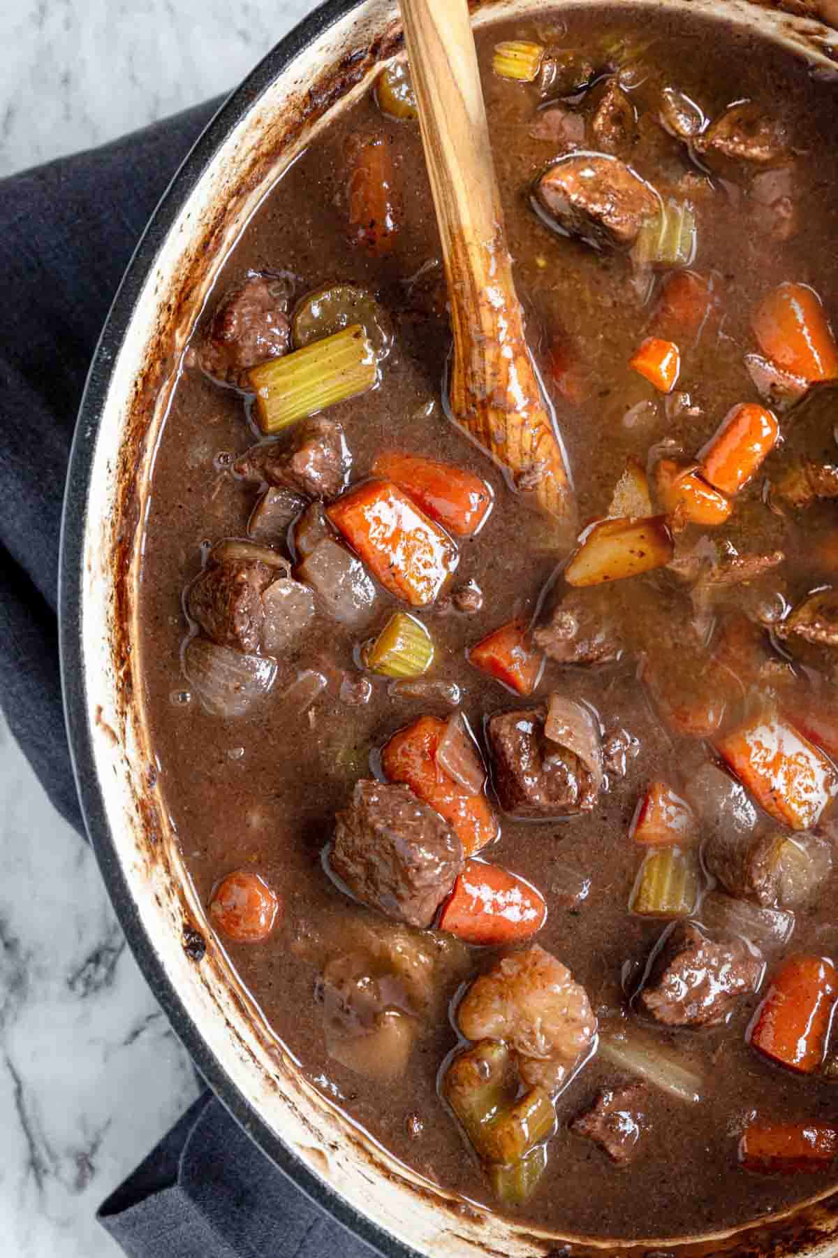 A large pot of beef stew made with red wine.