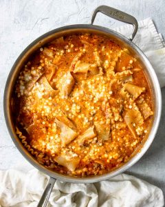 how to make skillet lasagna - step 2, mixing the cottage cheese into the sauce and noodles