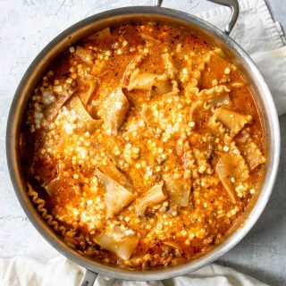 how to make skillet lasagna - step 2, mixing the cottage cheese into the sauce and noodles