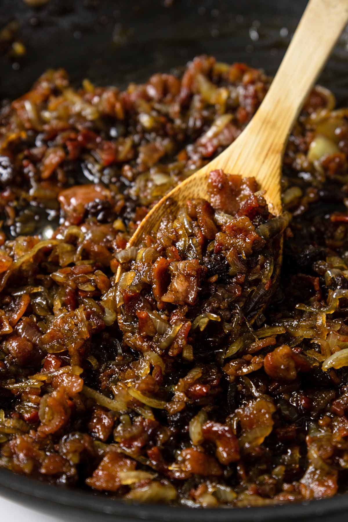 bacon jam on a wooden spoon