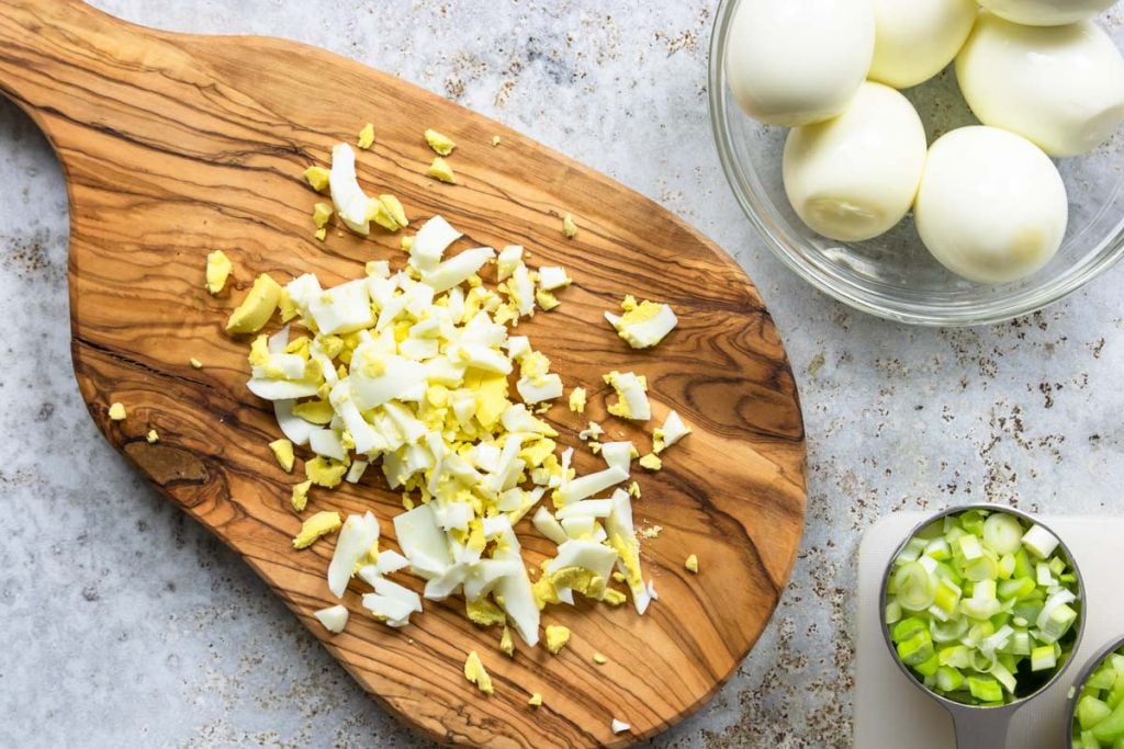 hard boiled egg chopped on a cutting board