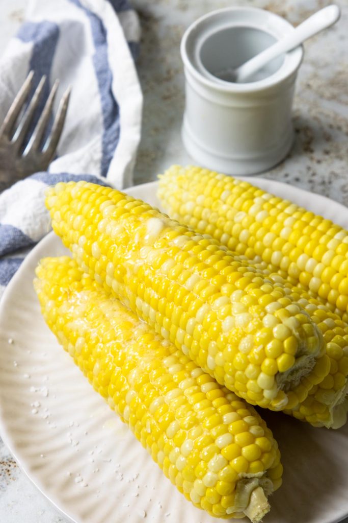 Corn on the cob on a white plate
