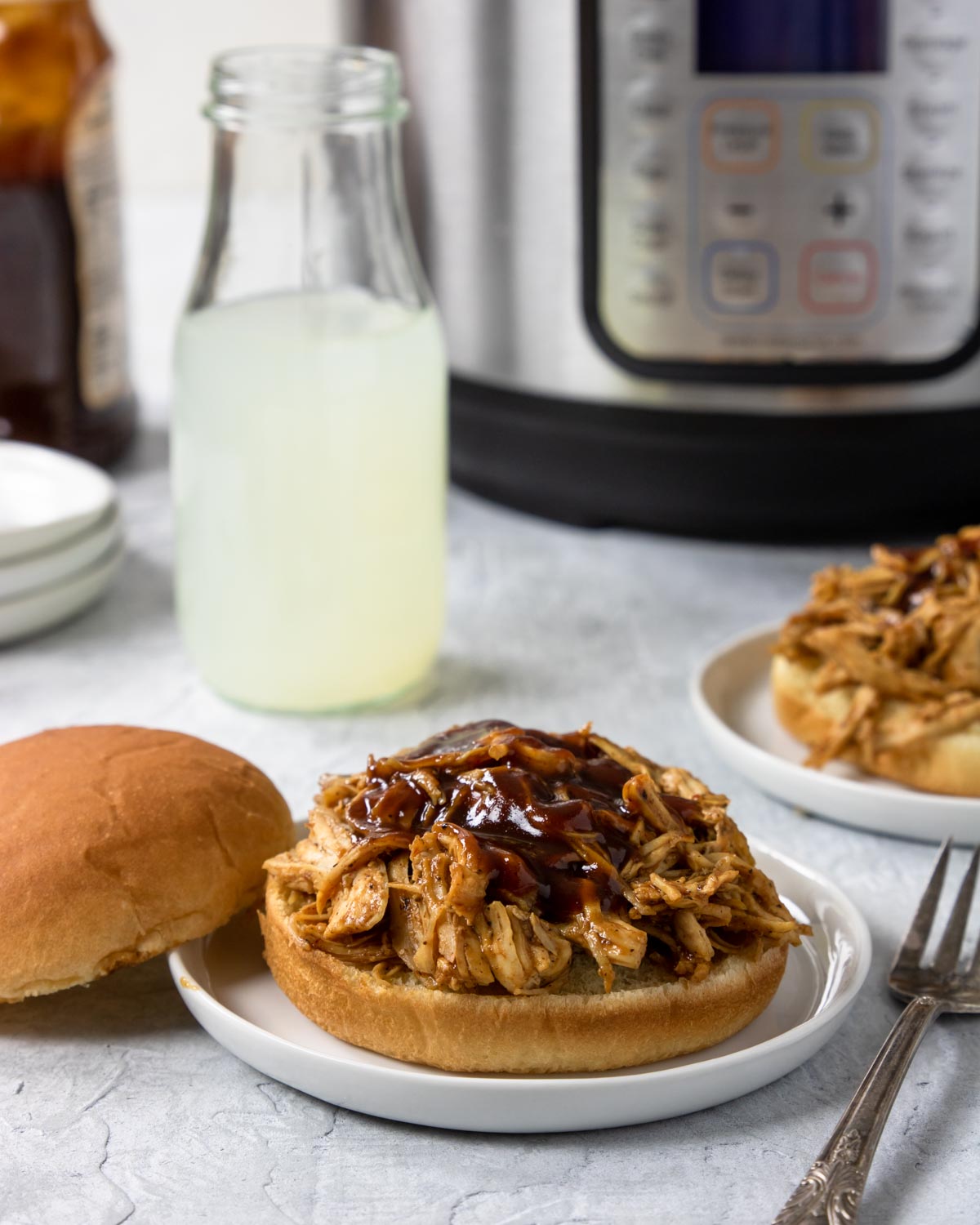BBQ chicken sandwiches with the instant pot in the background