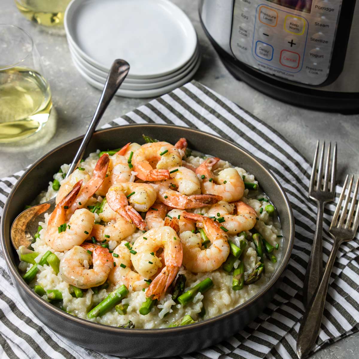 Instant Pot Shrimp Risotto in a bowl with an Instant Pot on the counter