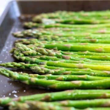 fresh asparagus on a roasting pan