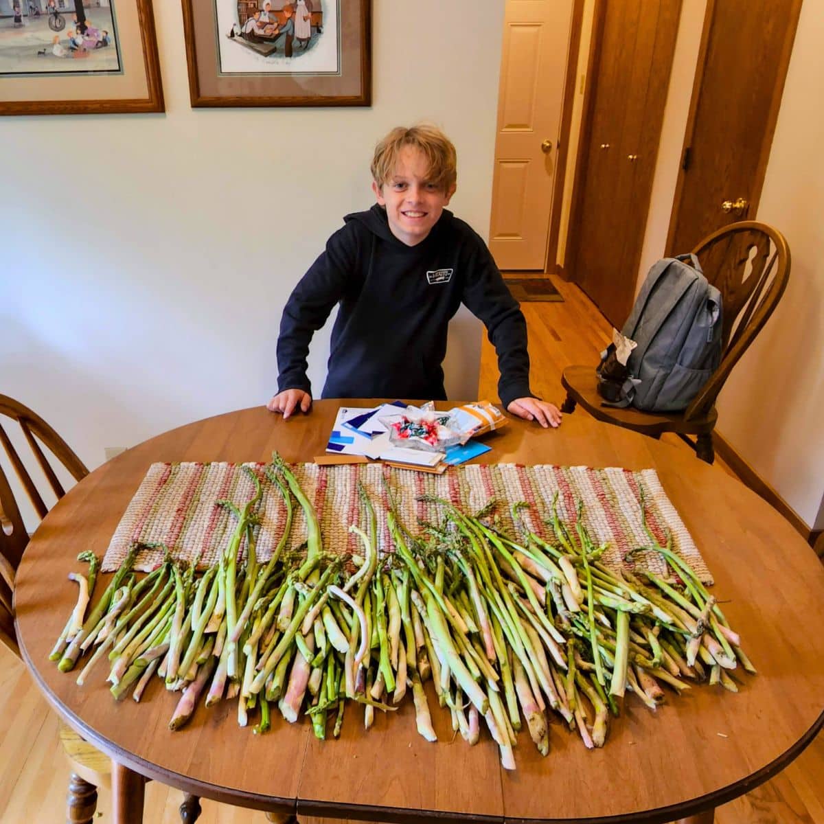 Kyle W with a stack of wild asparagus picked in Iowa