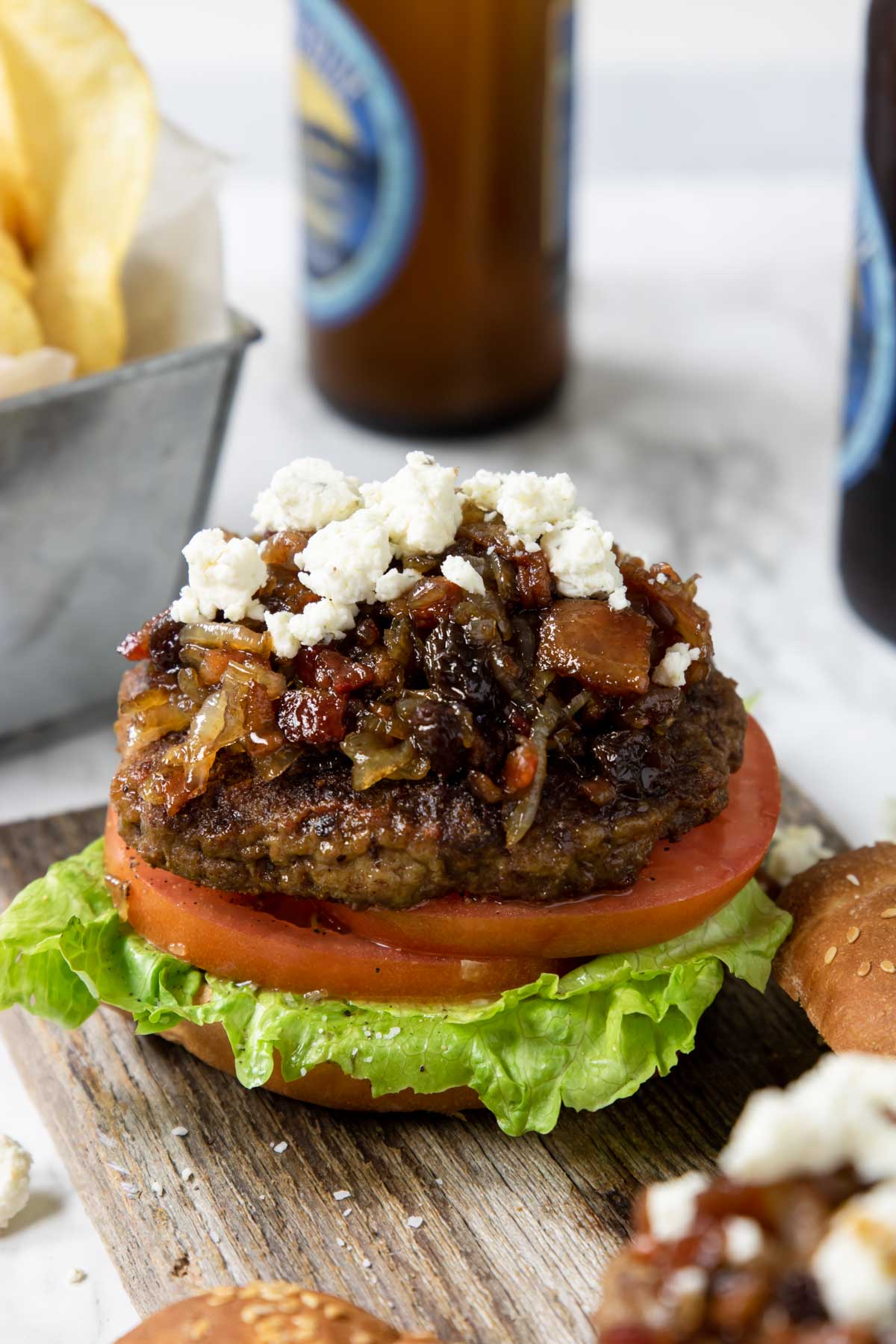 burger layered with lettuce, tomato, bacon jam and boursin cheese