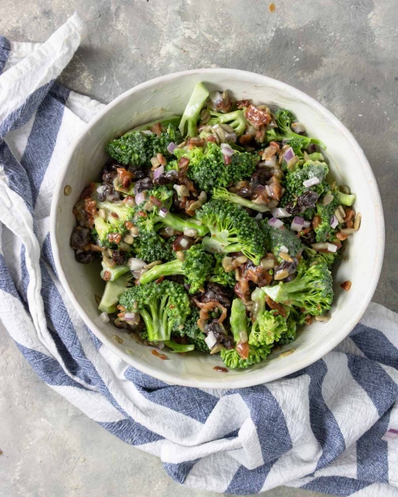 broccoli bacon salad made in a white bowl