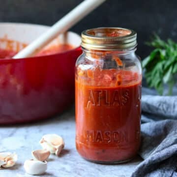 a mason jar full of homemade marinara sauce