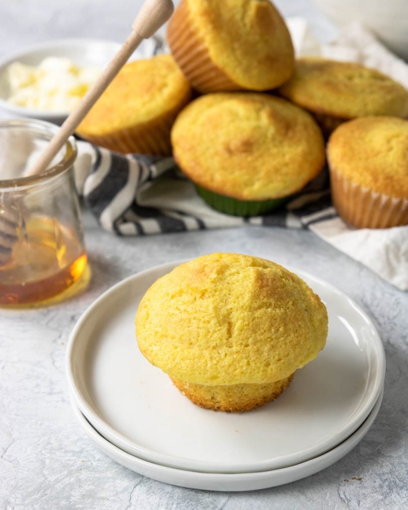 unwrapped cornbread muffin on a plate