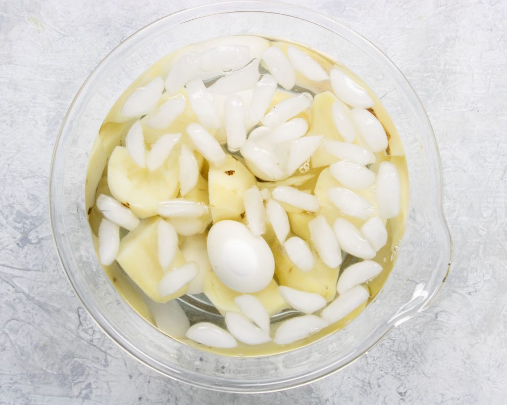 potatoes and eggs in an ice bath