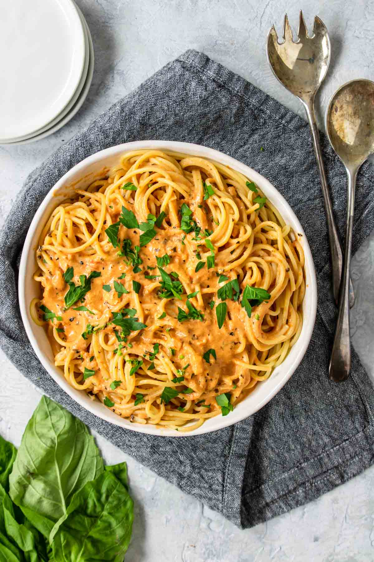 A bowl of pasta with tomato cream sauce