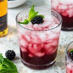 blackberry tequila smash with a fresh blackberry and mint