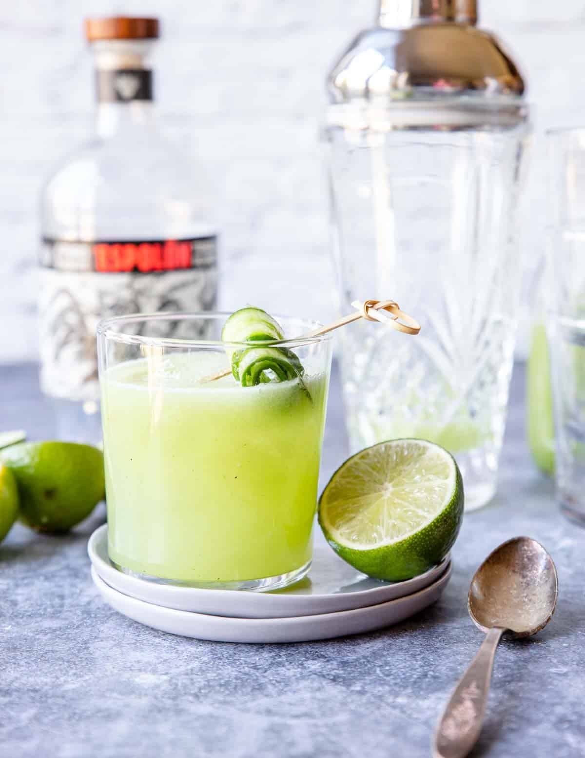 Cucumber Margarita in a glass with a fresh cucumber garnish