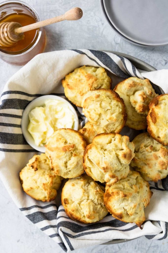 Easy Drop Biscuits in a basket with honey and butter