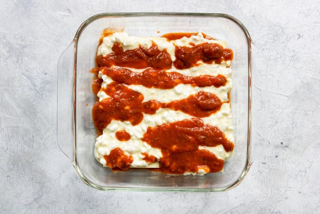 Layering Veggie Lasagna - noodles, cottage cheese and sauce