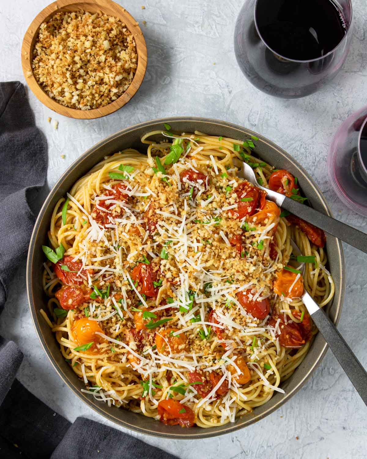 Pan Roasted Tomato Pasta in a bowl topped with bread crumbs and parmesan cheese