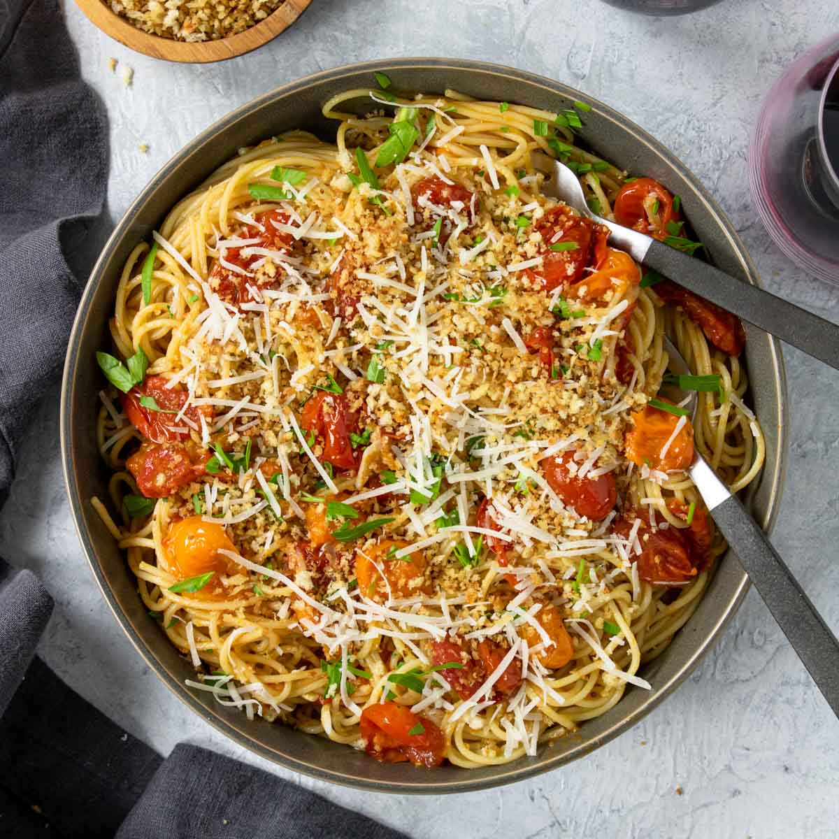 bowl of pasta topped with pan roasted tomato sauce and parm cheese