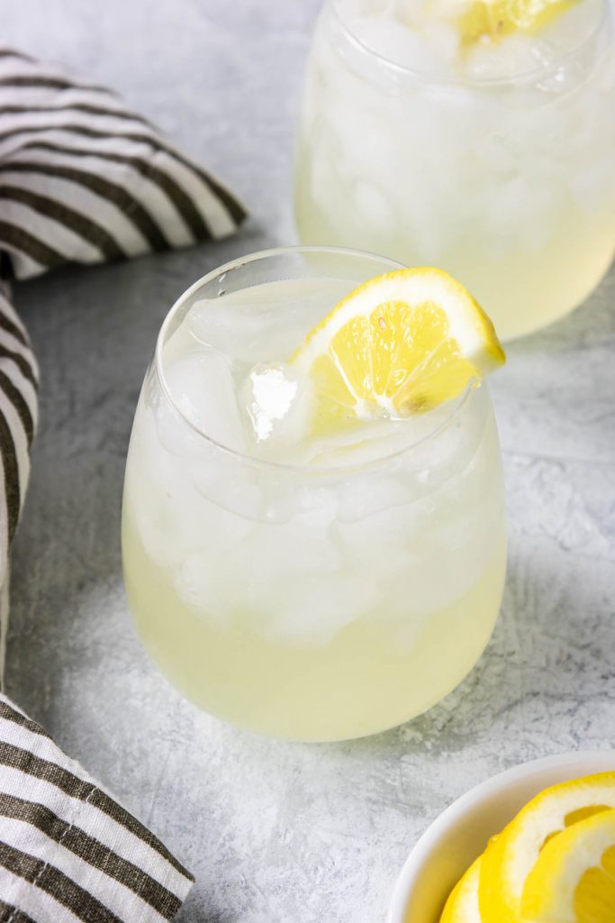 Vodka Lemonade recipe in a glass with a lemon wedge