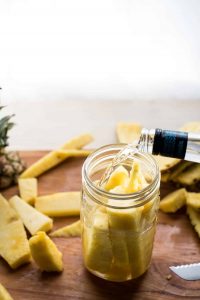 pineapple and tequila in a jar
