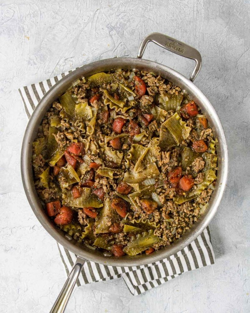 pesto lasagna in a skillet