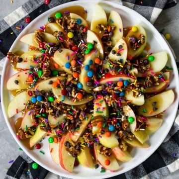 apple nachos with caramel m&m's, sprinkles and chocolate chips