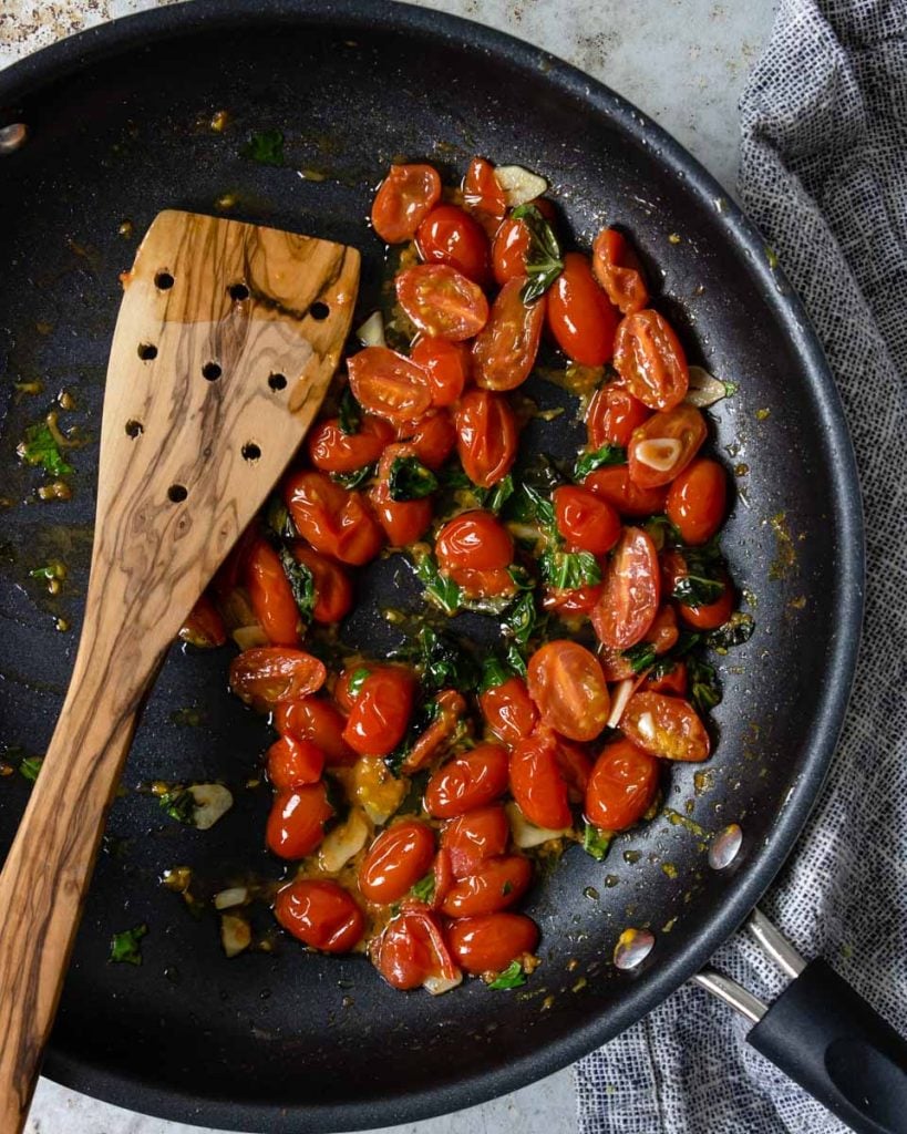 tomato garlic and basil in a skillet