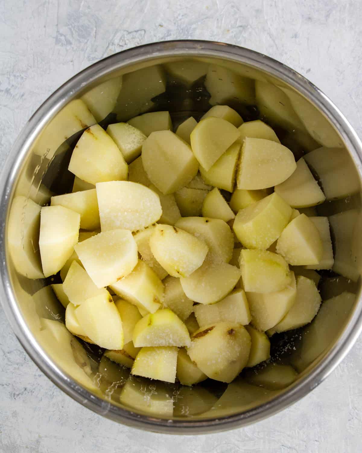 cut russet potatoes and kosher salt in the instant po