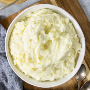 a large bowl of Instant Pot mashed potatoes on a table for dinner