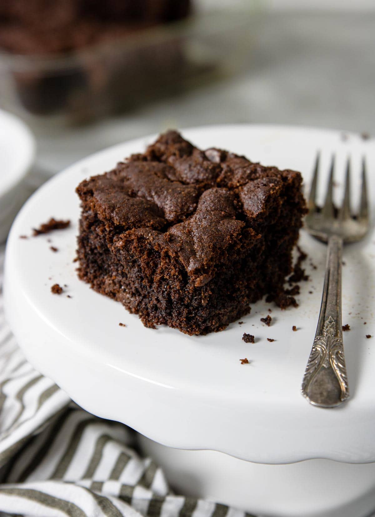 cake mix brownie on a cake plate with a fork