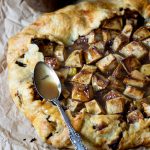 apple crostata with a spoonful of caramel
