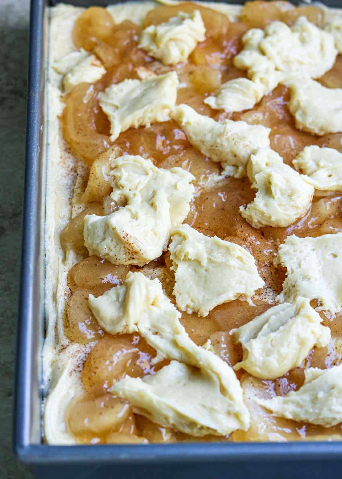 Apple Pie Bars in a baking pan before they are put into the oven