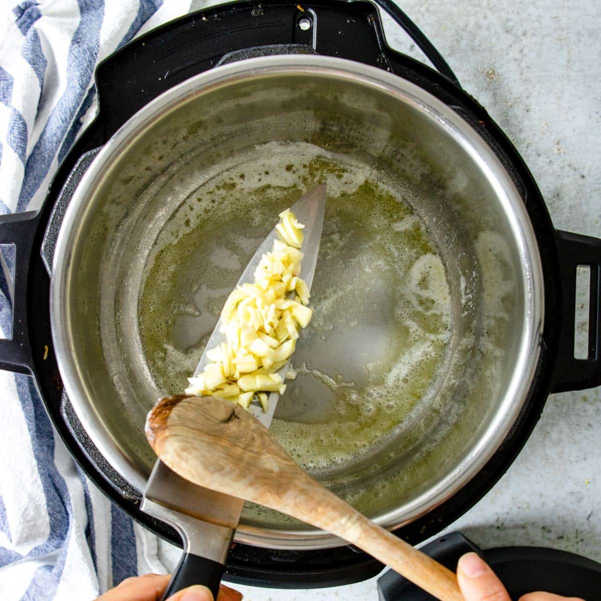 putting garlic into the instant pot