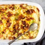 loaded twice baked potato casserole topped with bacon and green onions