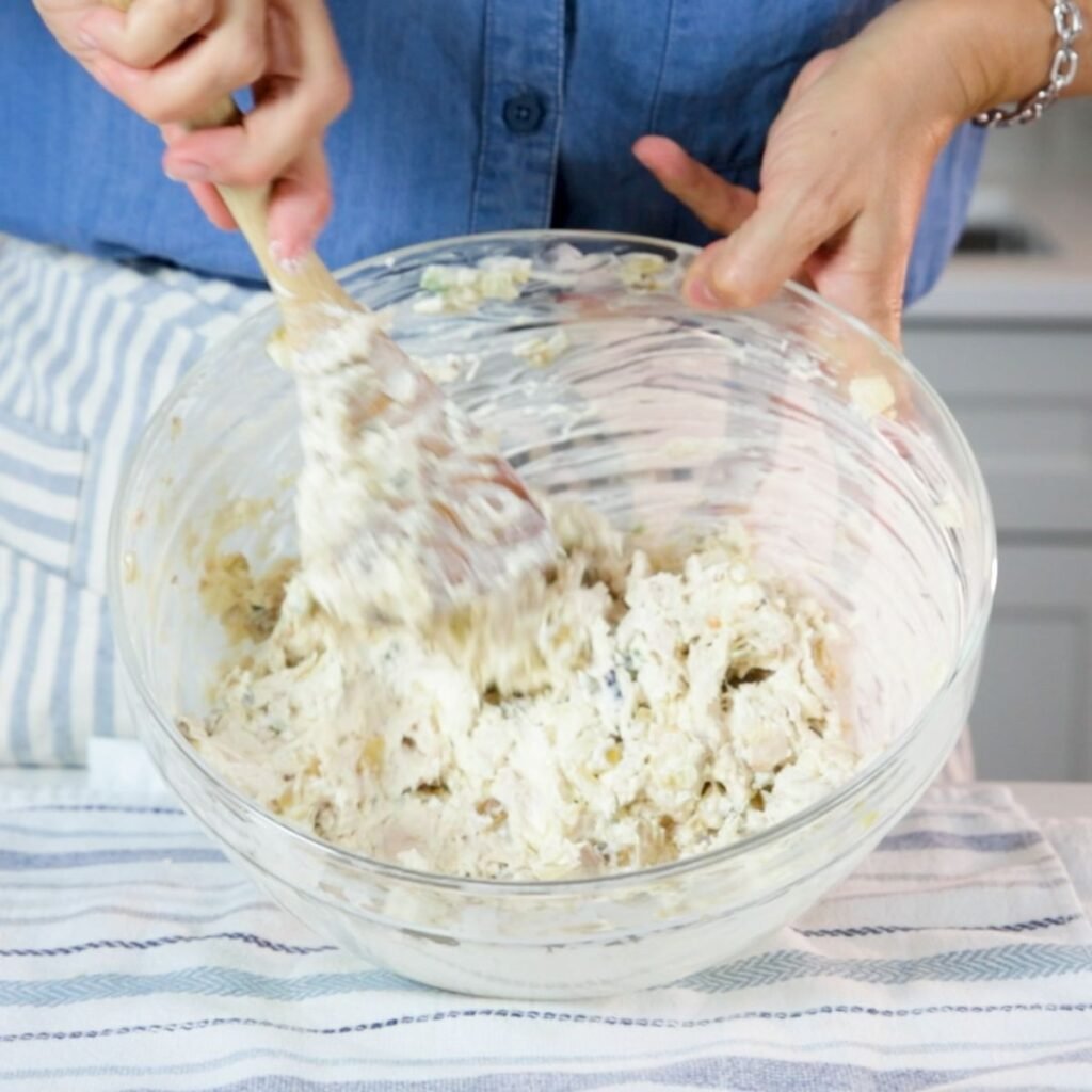 Cream Cheese Chicken filling being mixed together 