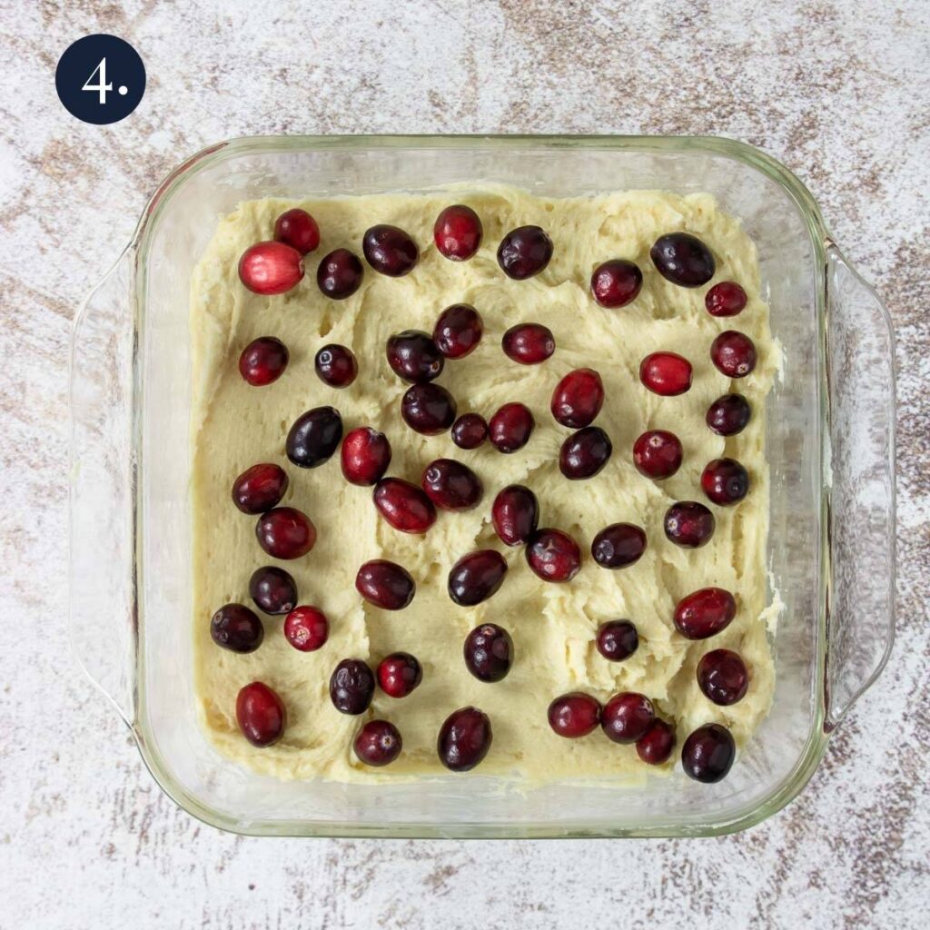 fresh cranberries on top of cake batter