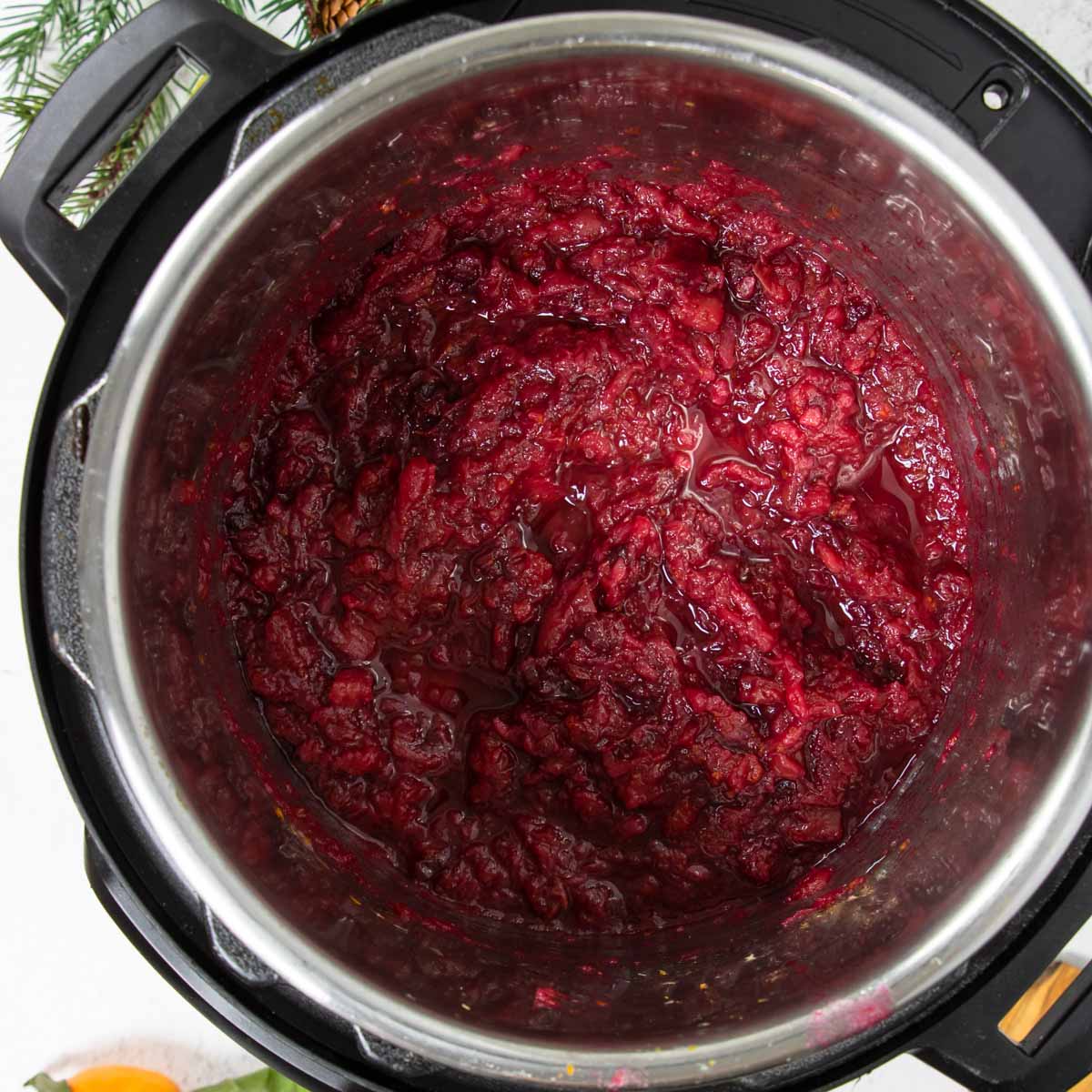 An instant pot with cranberry sauce inside