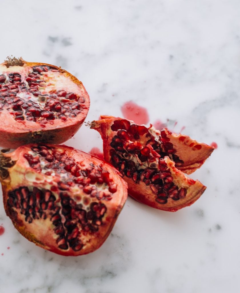 A fresh pomegranate cut in pieces