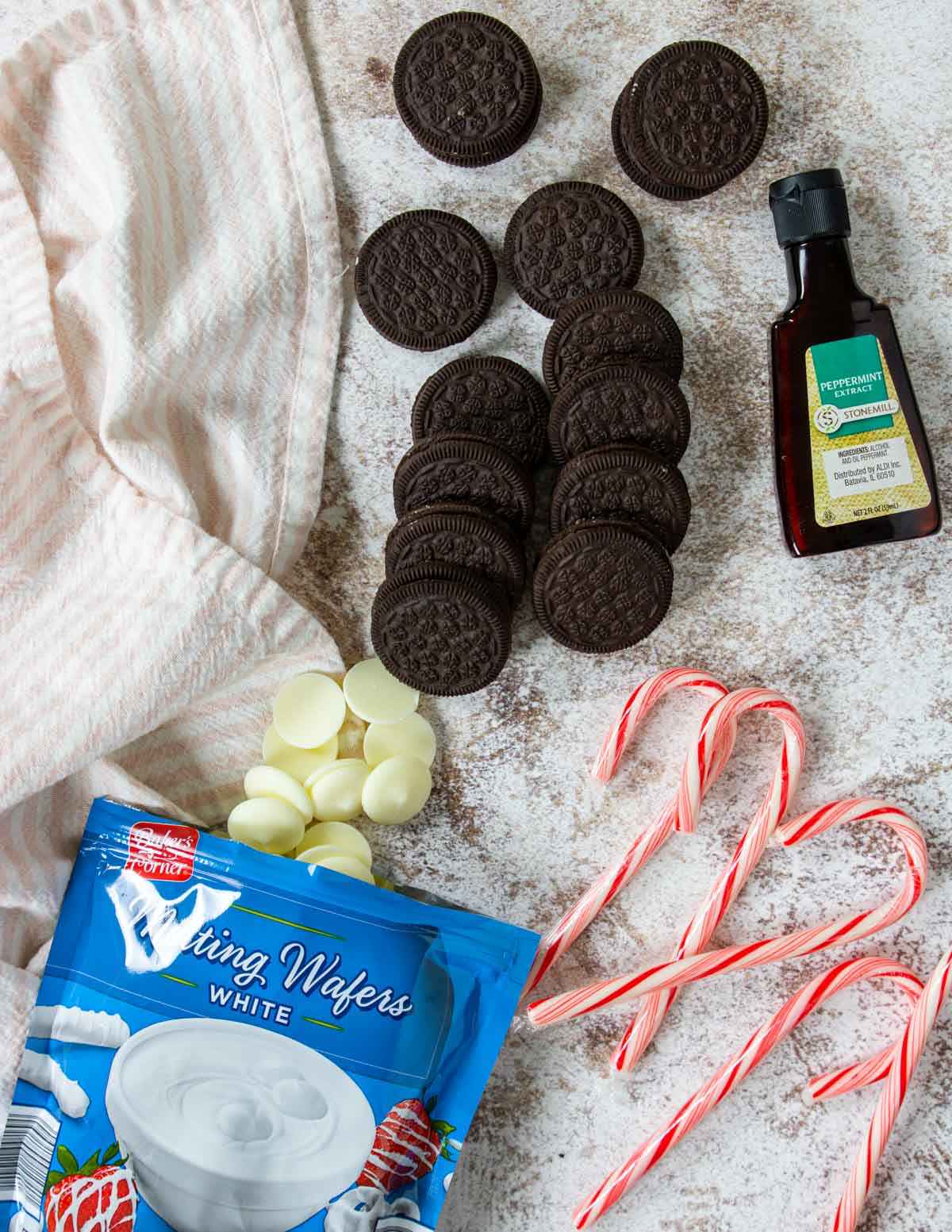 4 ingredients laid out to make peppermint bark oreos