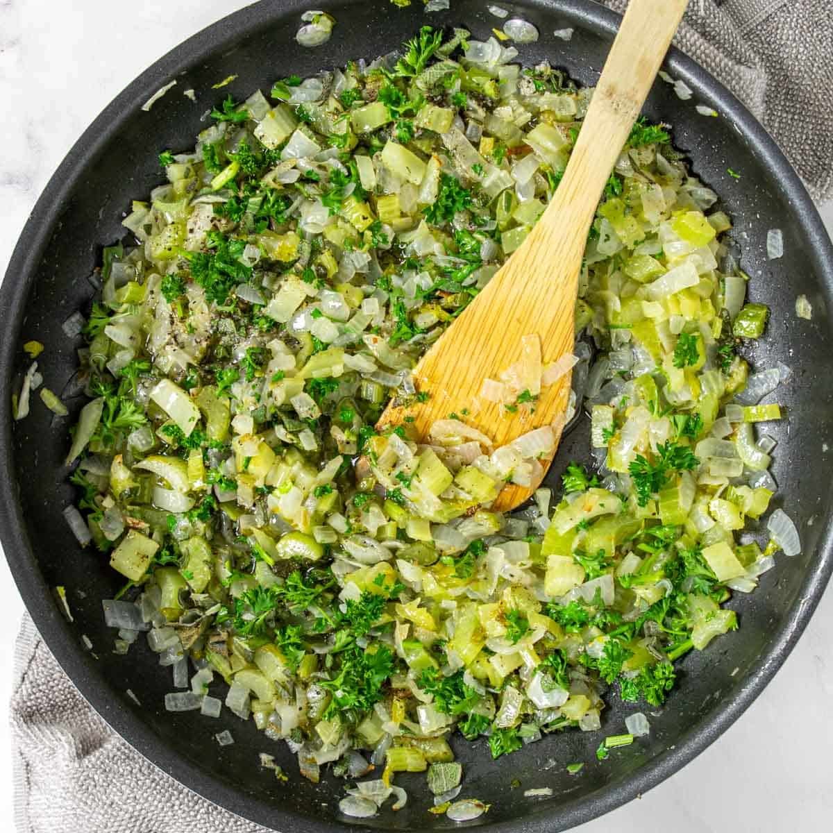 celery, onions, sage, parsley and seasonings in a skillet